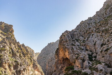 Sunny day over the rocks and the blue water in Sa Calobra, Palma de Mallorca, Balearic Islands, Spain