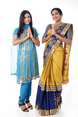 Two South east Asian Indian race ethnic origin woman wearing Indian dress costume sharee and salwar kameez multiracial community on white background