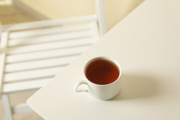 Cup of tea on white wooden table