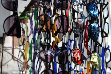 Colorful sunglasses selling on a open shop at a busy market, at Esplanade, Kolkata.