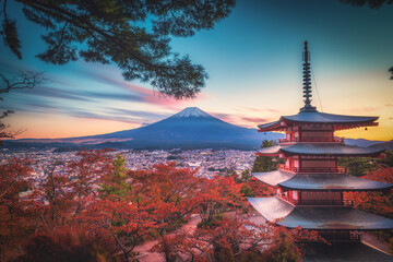 Fototapeta na wymiar Mt. Fuji with Chureito Pagoda and red leaf in the autumn on sunset at Fujiyoshida, Japan.