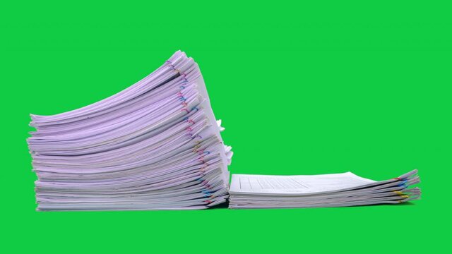 Stop motion animation Stacks overload document paper files on chroma key green screen background. Alpha Channel.