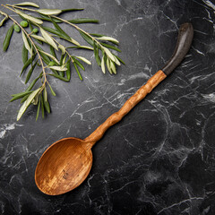 wooden spoon on black marble in the kitchen