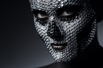 sexy woman with skull face of rhinestones