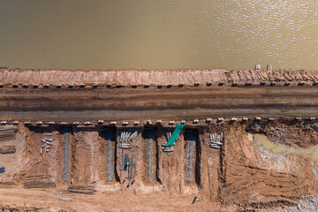 Aerial view between bridge construction site work with bypass road.