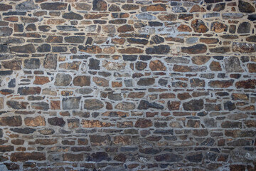 Obraz premium Large stone wall masonery, texture background, belgium, europe