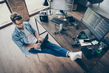 Top above high angle view of his he nice attractive focused skilled guy geek typing coding web...
