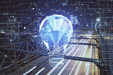 Multi exposure of bulb hologram drawing and cityscape background. Concept of idea.