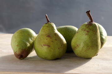 Pears mini on wooden chopping board