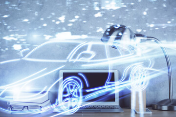 Naklejka premium Desktop computer background in office with automobile hologram drawing. Multi exposure. Tech concept.