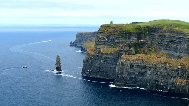 Cliffs of moher with O Brien Tower, atlantic ocean and clouds