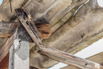damaged wooden beam under fibre cement