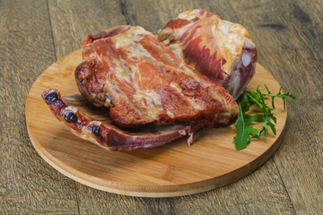 Smoked pork ribs over the wooden background