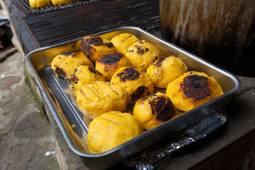 grill bulz. Romanian traditional food from grilled polenta filled with cheese