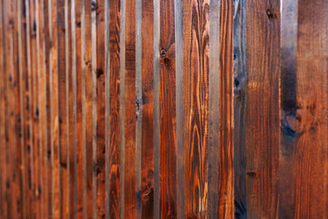 Shallow depth of field brown wooden planks in a row.
