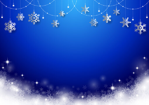 雪の結晶がぶら下がった キラキラ イルミネーションのクリスマス背景 フレーム 青