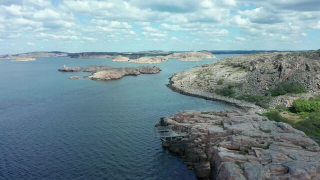 West Sweden coastline archipelago with granite rocks and rocky stone islands in aerial view. Beach park with diving platform. Seascape view of Swedish nature in Bohuslan