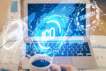 Double exposure of blockchain theme hologram and table with computer background. Concept of bitcoin...