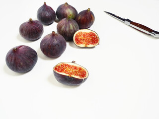 Fresh ripe figs on white background