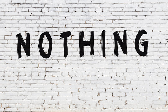 White wall with black paint inscription nothing on it