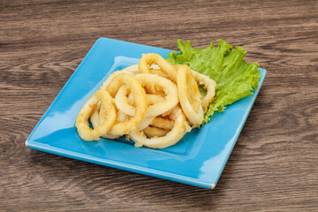 Roasted squid rings with salad