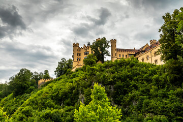Fototapeta na wymiar The castle Hohenschwangau in Füssen, Bavaria, Germany at a cloudy day in summer.