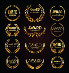 Golden award signs with laurel wreath isolated on black background