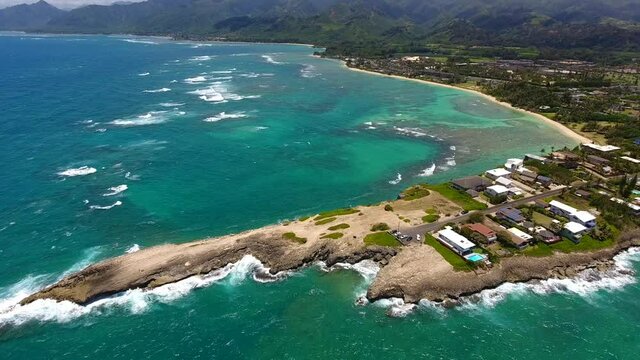 Aerial  Laie Point, North Shore of Oahu Hawaii. Scenic views of the ocean lapping against the rocky coast and the offshore seabird sanctuary await visitors to Laʻie Point State Wayside.