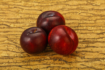 Ripe sweet plum fruit heap
