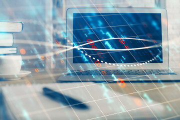 Stock market graph and table with computer background. Multi exposure. Concept of financial analysis.