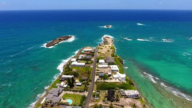 Aerial  Laie Point, North Shore of Oahu Hawaii. Scenic views of the ocean lapping against the rocky coast and the offshore seabird sanctuary await visitors to Laʻie Point State Wayside.