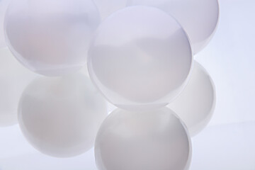 Abstract background. Large white pearl balls. Close view.
