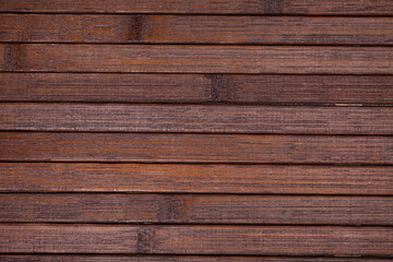 Obraz premium Natural dark brown wooden planks background with copyspace..