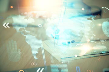 Multi exposure of hands making notes with world map hologram and data theme icons. Concept of global data.