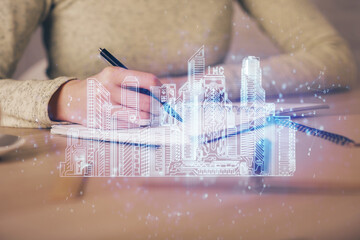 IOT drawing over writing hands in notepad background. Concept of smart home. Multi exposure