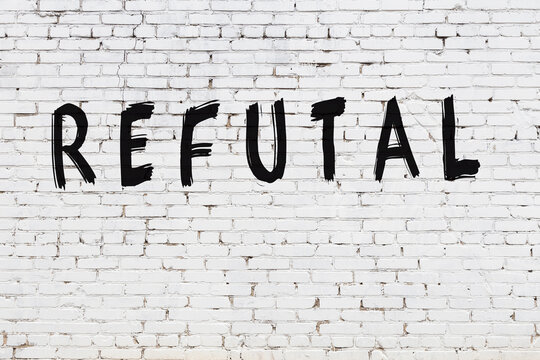 Inscription refutal painted on white brick wall