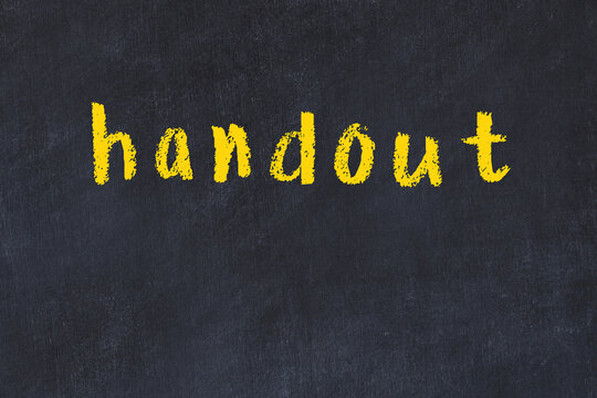 College chalk desk with the word handout written on in