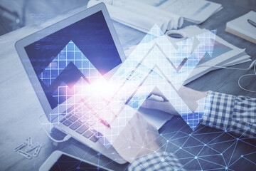 Growing arrows with businessman working on computer on background. Success concept. Double exposure.