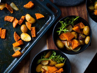 Home made roast vegetables with arugula and beetroot puree. Natural light.