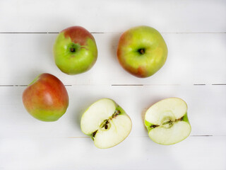 Apples on a white wooden table.