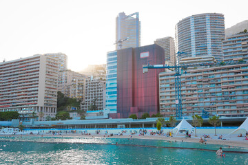Fototapeta na wymiar Monaco-Montecarlo, wonderful city of the cote-d‚ÄôAzur with its marine and architectures, Larvotto Beach, in a sunny day with blue sky