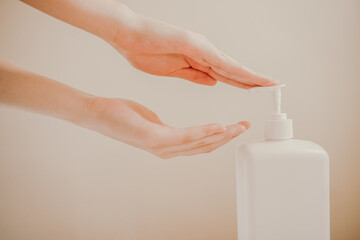 Women's hands washed with alcohol gel. Hand sanitizer.