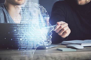 Businessman with computer background with brain theme hologram. Concept of brainstorm. Multi exposure.