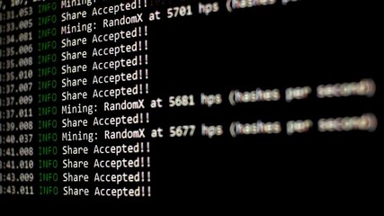 Mining Cryptocurrency process program on display PC. Display screen with cryptocurrency miner. Cryptocurrency mining on a computer screen. Share Found. Selective focus. - Powered by Adobe