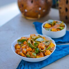 Curdled milk with capsicum.
Popularly known as paneer in Indian subcontinent.