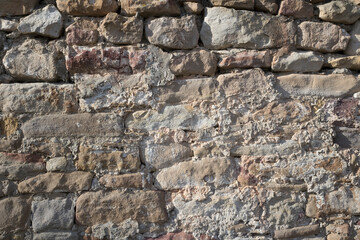 Stone wall grunge rough texture background.