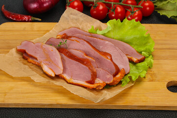 Sliced smoked duck breast served salad