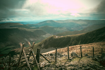 landscape with a fence and clouds