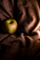 Apple on the black background behind you