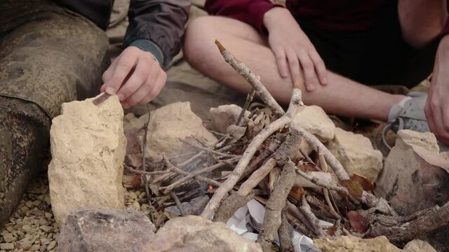 Close Up Shot Of The Gay Couple Are Camping And Starting The Campfire.